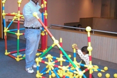 Philadelphia resident Chaka Wilson (left) and his son Amari, play with Toobeez at the Please Touch Museum.